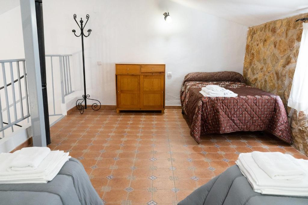 Postel nebo postele na pokoji v ubytování Hospedium DLJ Respira Cazorla