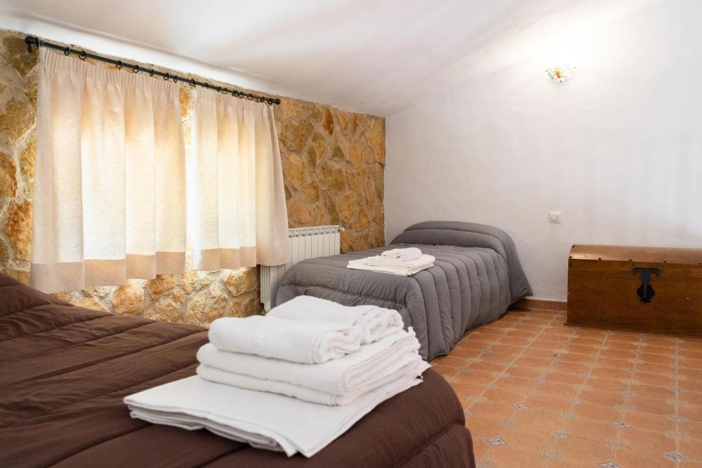 Postel nebo postele na pokoji v ubytování Hospedium DLJ Respira Cazorla