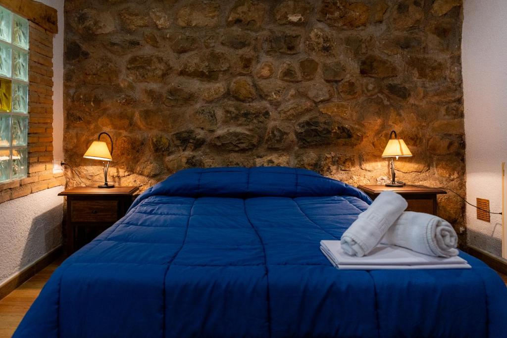 Postel nebo postele na pokoji v ubytování Hospedium DLJ Respira Cazorla