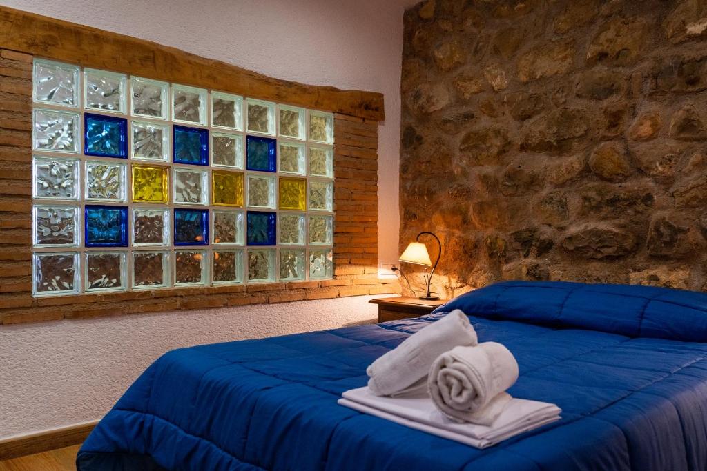 Postel nebo postele na pokoji v ubytování Hospedium DLJ Respira Cazorla