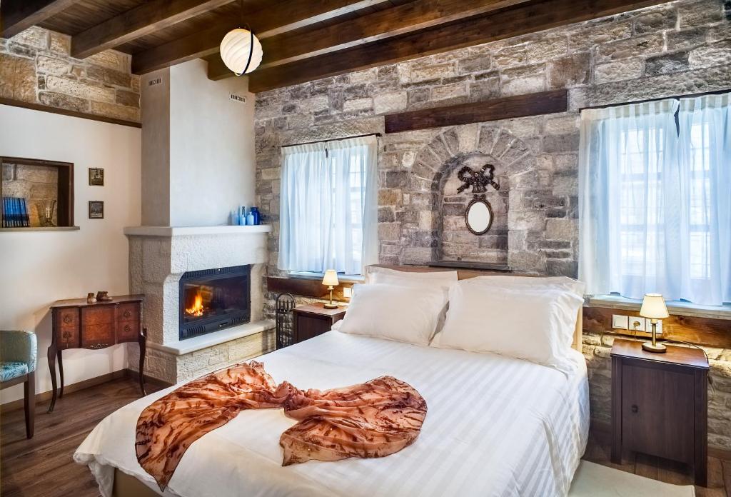 Postel nebo postele na pokoji v ubytování Gioraldi Art Hotel
