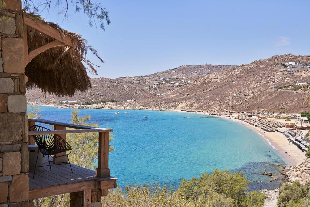 a balcony of a house with a view of a beach at Boheme Beach Houses in Elia Beach