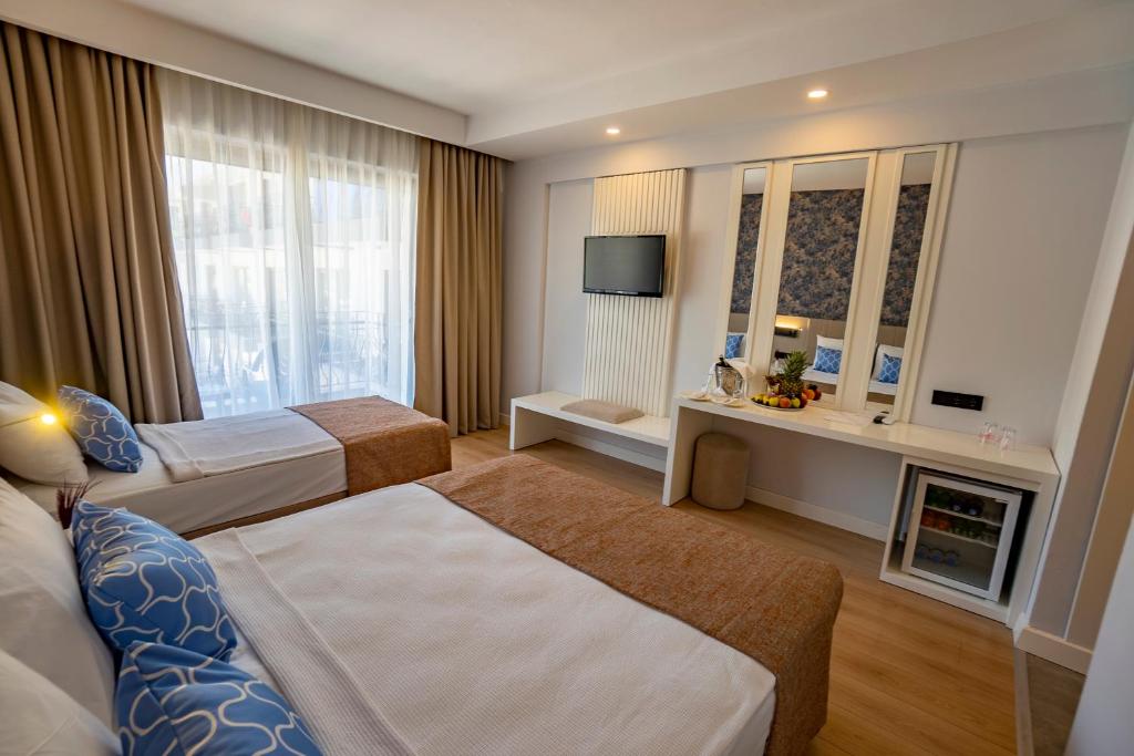 Postel nebo postele na pokoji v ubytování Eldar Garden Resort
