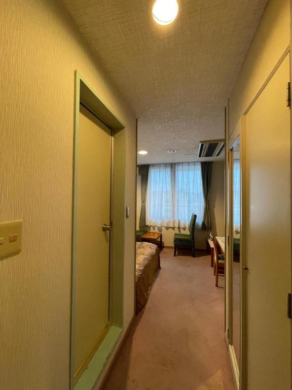 Postel nebo postele na pokoji v ubytování Hotel Ginsui