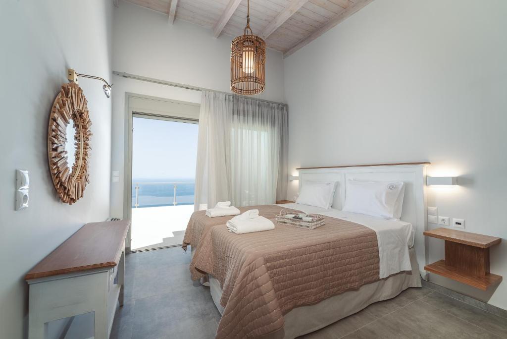 Postel nebo postele na pokoji v ubytování Owl Villas