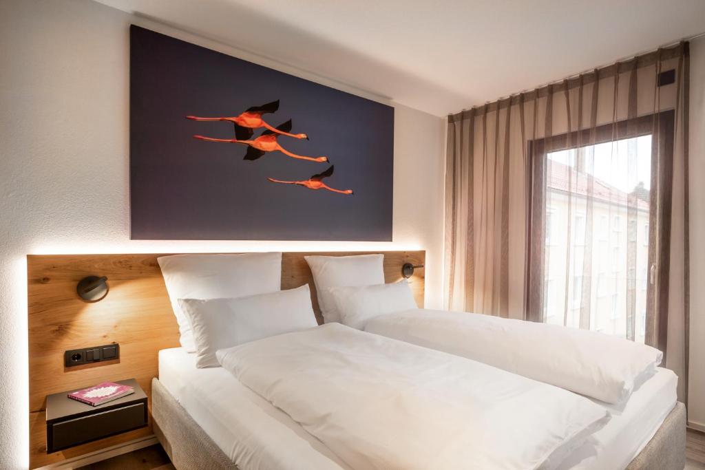 Postel nebo postele na pokoji v ubytování PRIMERA Apartments