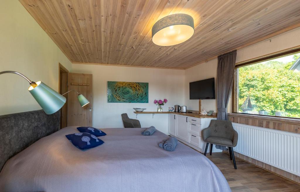 TV a/nebo společenská místnost v ubytování Huusi Holiday