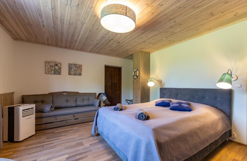 Postel nebo postele na pokoji v ubytování Huusi Holiday
