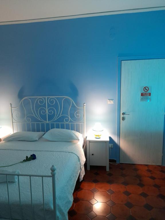 Tempat tidur dalam kamar di B & B Arbostella Dream Stay