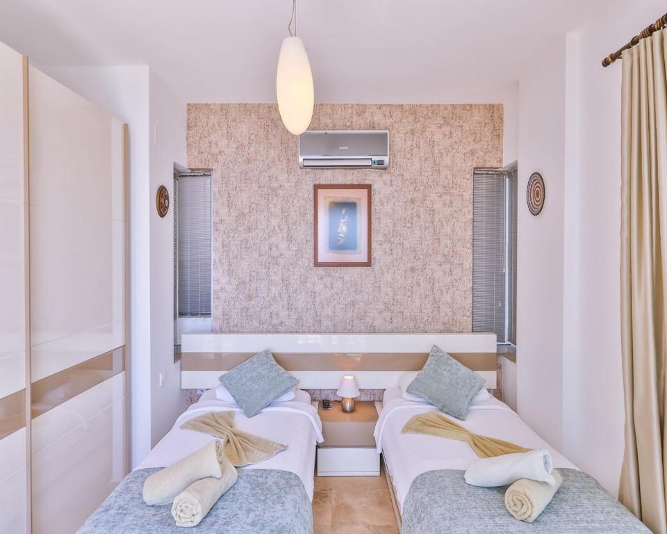 Postel nebo postele na pokoji v ubytování Villa Troya Kas Peninsula