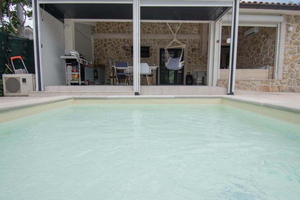 a large pool of water in a house at Villa Kamena in Vitina