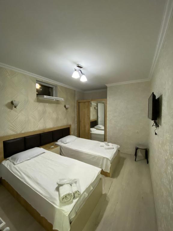 Postel nebo postele na pokoji v ubytování Guest House Imereti