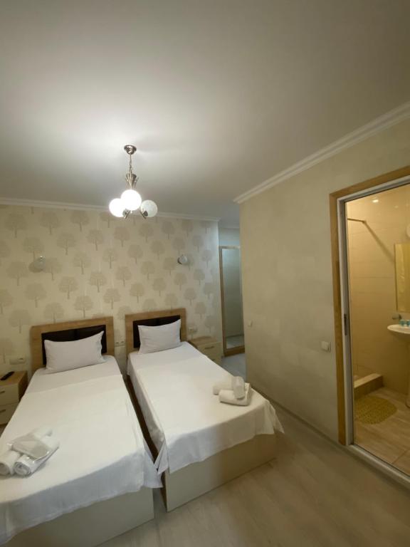 Postel nebo postele na pokoji v ubytování Guest House Imereti