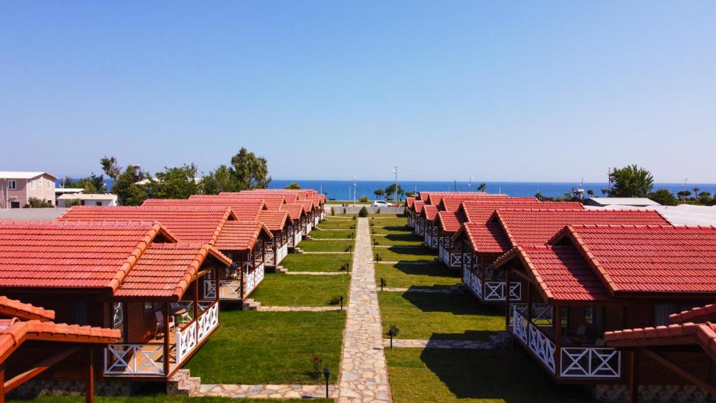 a row of red roofs on a building at MARTI BUNGALOW in Demre