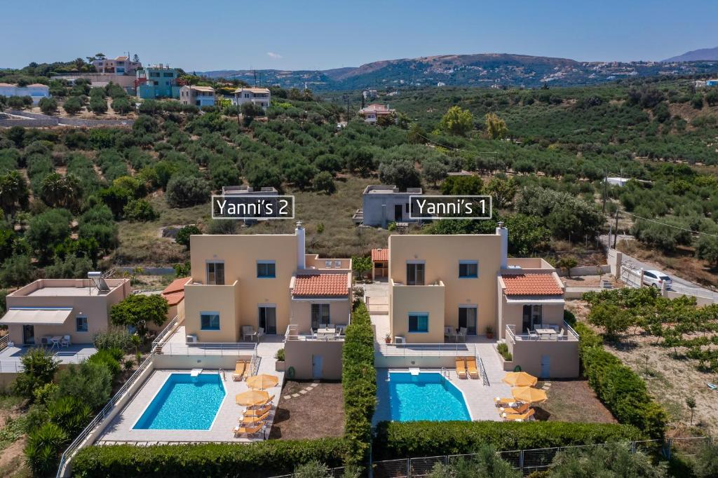 an image of a villa with two swimming pools at Yanni's Villas in Adelianos Kampos