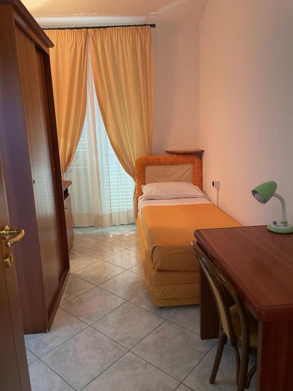 A bed or beds in a room at Il Cinghialetto