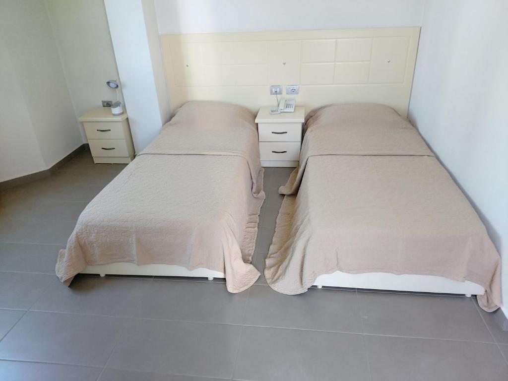 Postel nebo postele na pokoji v ubytování Hotel Piazza