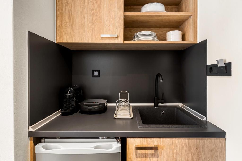 Kuchyňa alebo kuchynka v ubytovaní Sigma Luxury Rooms