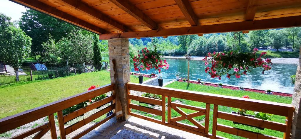 a view from a porch with a view of a river at DRINALAND in Ljubovija