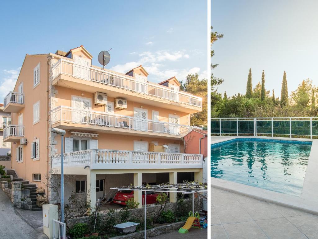 un edificio y una piscina al lado de un edificio en Villa Voinic, en Cavtat