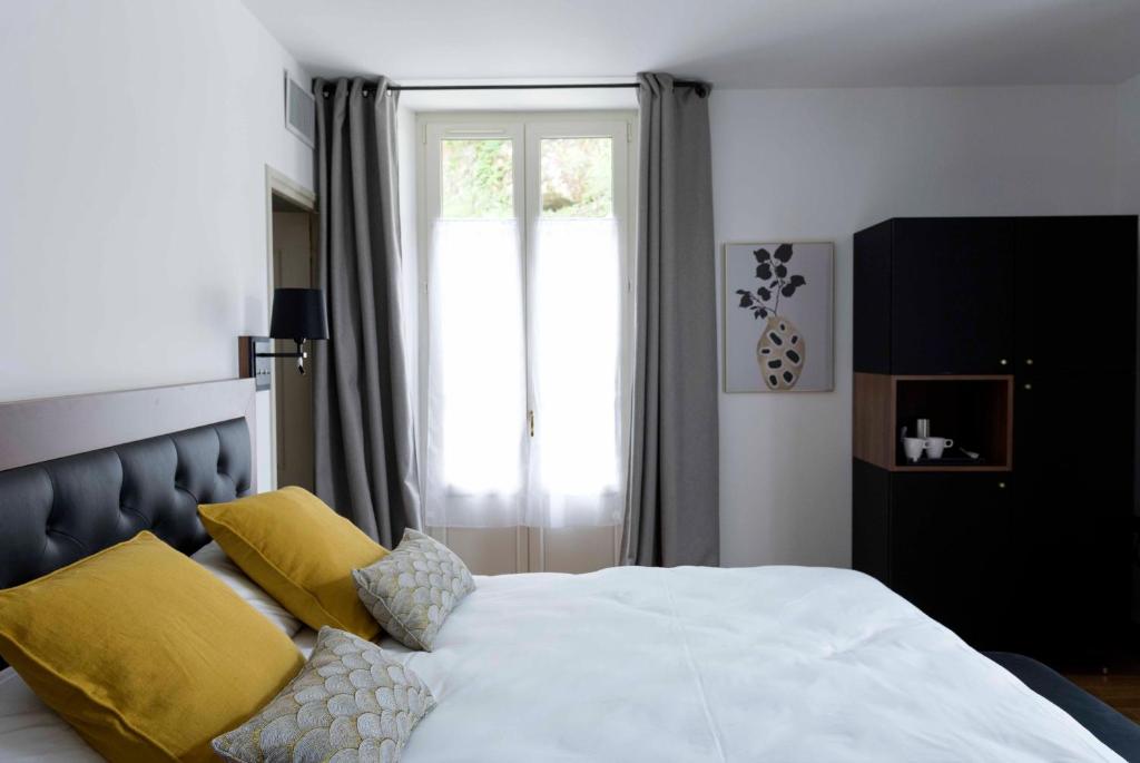 Postel nebo postele na pokoji v ubytování Hotel Beau Site - Rocamadour