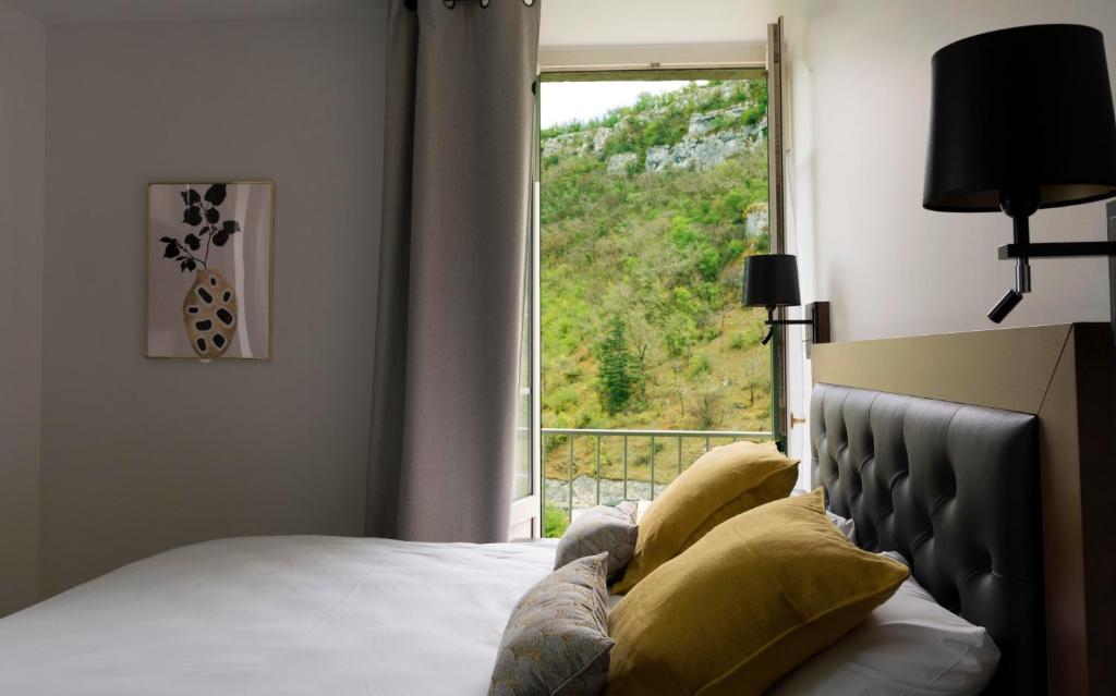 Postel nebo postele na pokoji v ubytování Hotel Beau Site - Rocamadour