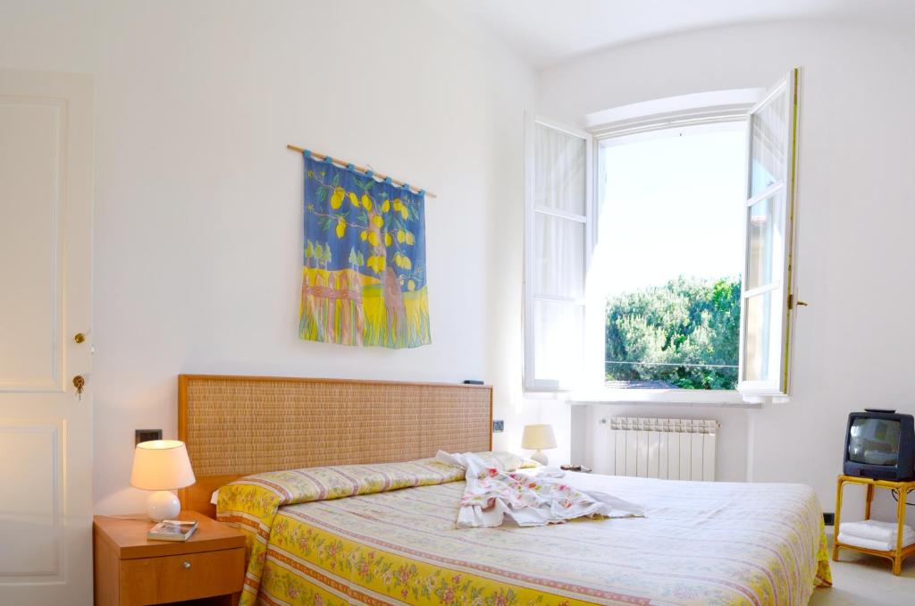 Postel nebo postele na pokoji v ubytování Hotel Villa Fiorisella