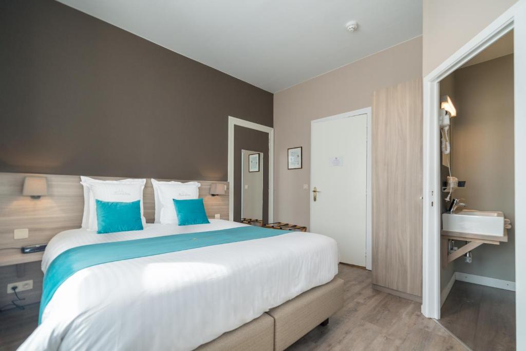 Postel nebo postele na pokoji v ubytování Hotel Maraboe