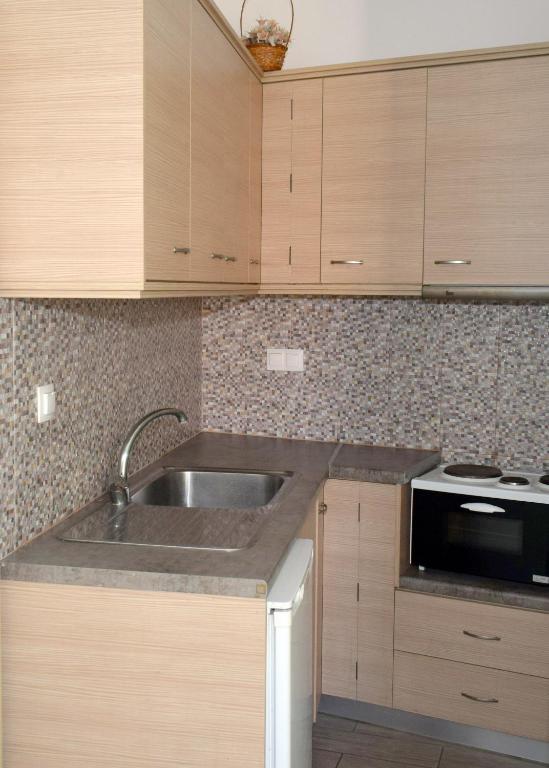 Kuchyň nebo kuchyňský kout v ubytování En Plo Studios & Apartments