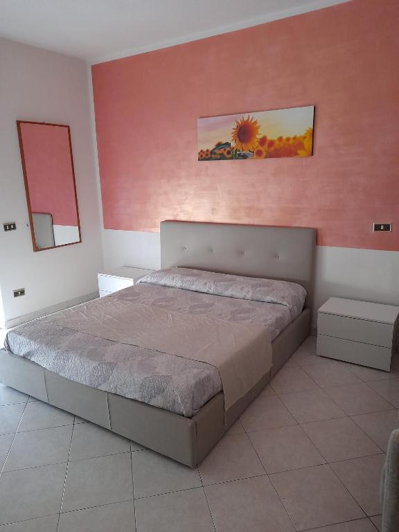 Postel nebo postele na pokoji v ubytování Hotel De Rosa