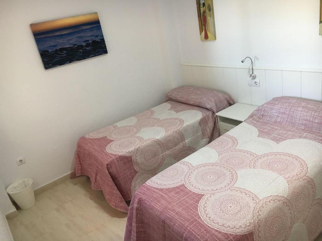 Posteľ alebo postele v izbe v ubytovaní Apartamento Beach