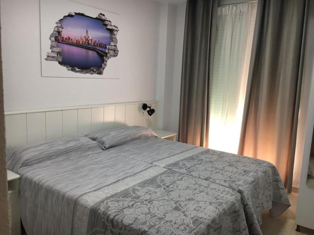 Posteľ alebo postele v izbe v ubytovaní Apartamento Beach