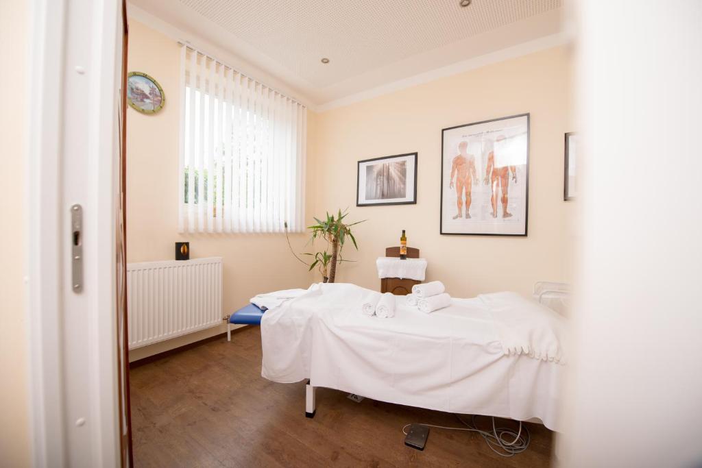 Postel nebo postele na pokoji v ubytování Hotel Forellenhof