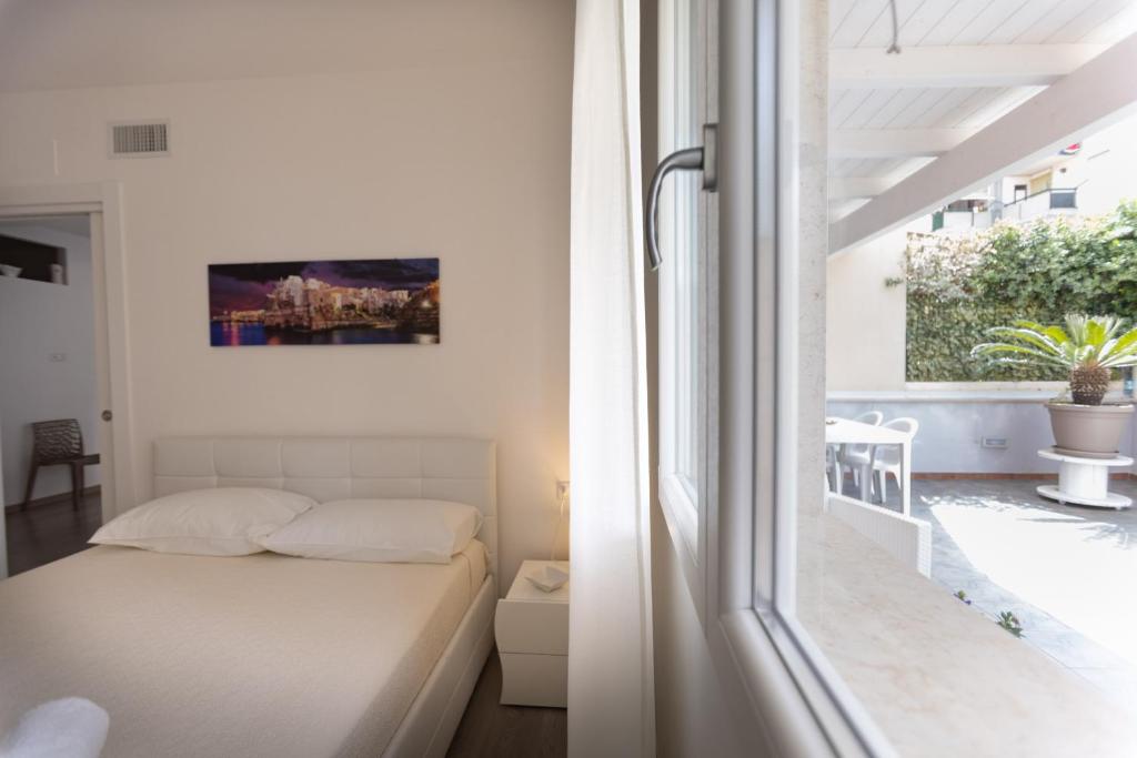 Postel nebo postele na pokoji v ubytování B&B Il più bello dei mari
