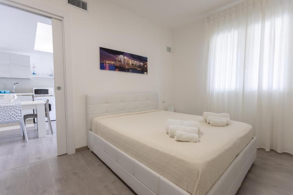 Postel nebo postele na pokoji v ubytování B&B Il più bello dei mari