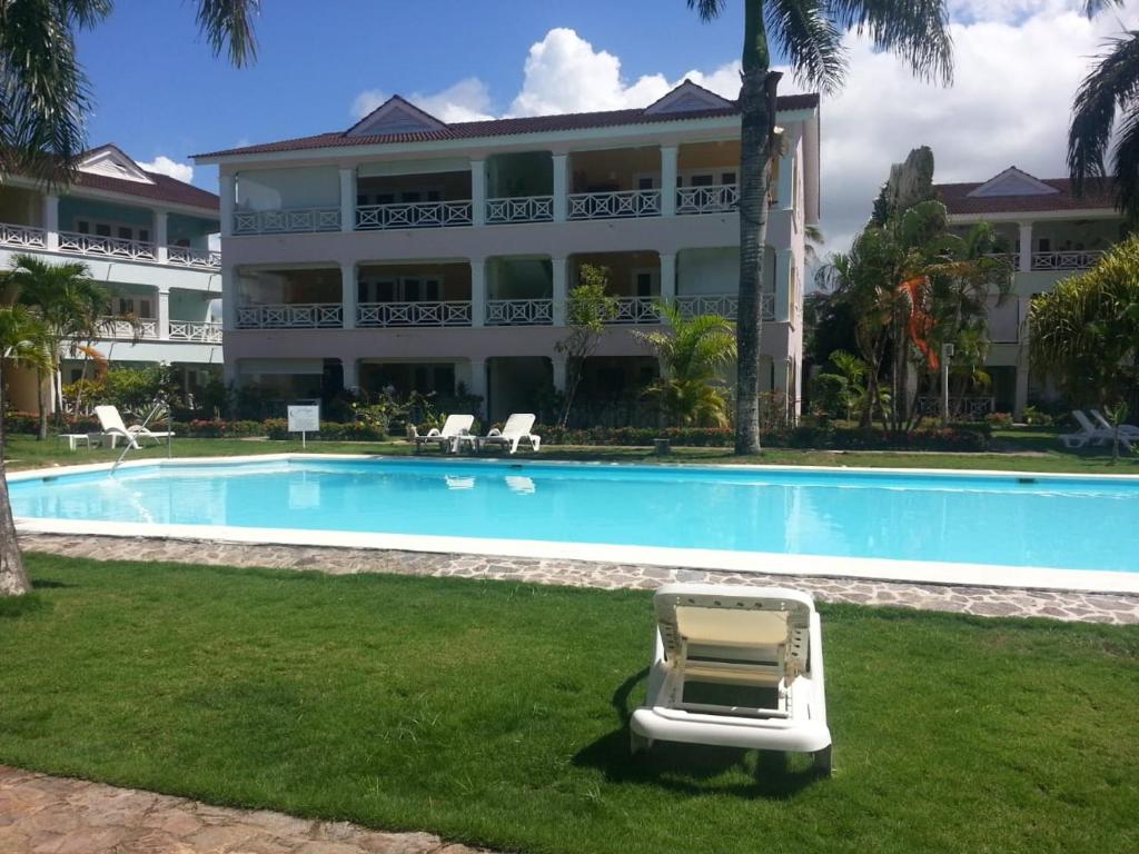 a pool in front of a large building at Playa Turquesa only 50m From the Beach Walk to all Restaurants in Las Terrenas