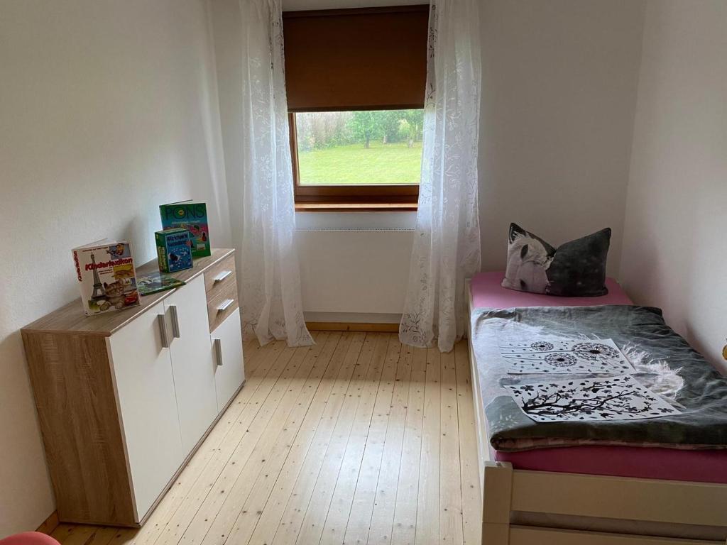 Postel nebo postele na pokoji v ubytování Ferienwohnung Wiek