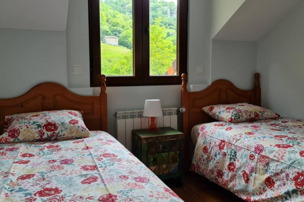 Postel nebo postele na pokoji v ubytování La Pasiega