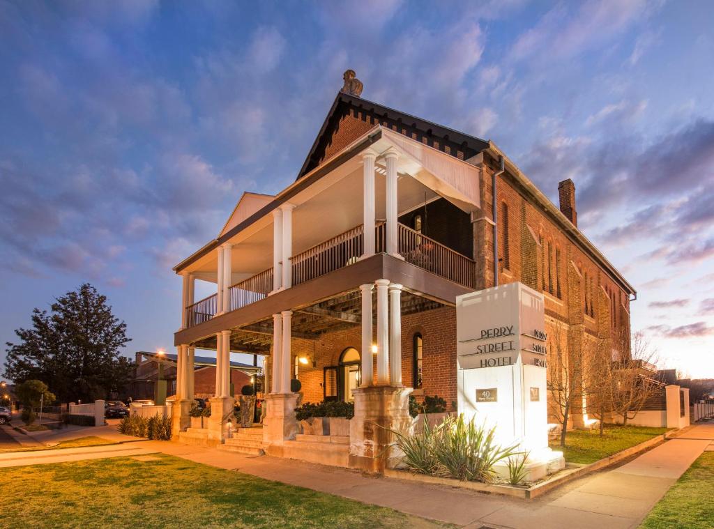 a large brick building on a street at Perry Street Hotel in Mudgee