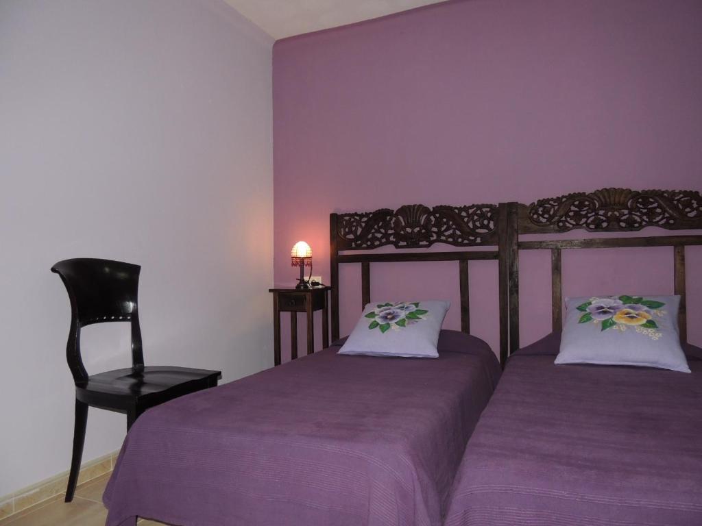 Postel nebo postele na pokoji v ubytování Hostal Can Massot