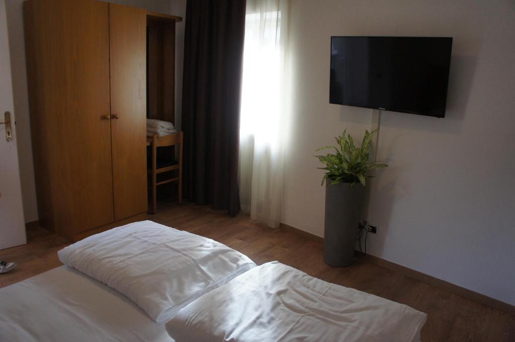 Postel nebo postele na pokoji v ubytování Vecchia Mori