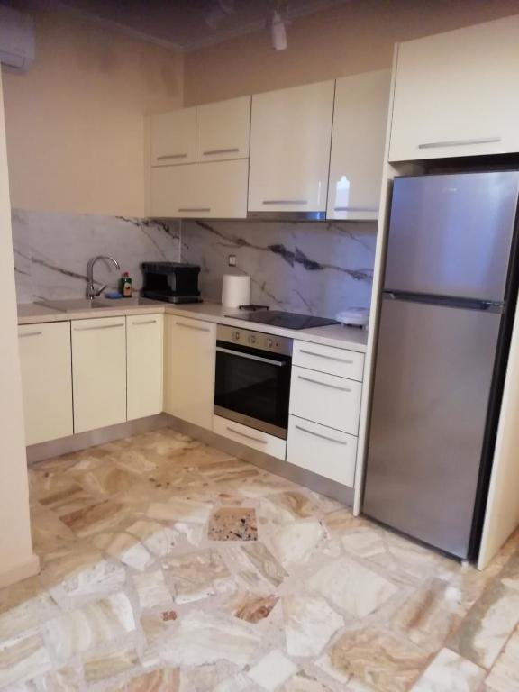 Kuchyň nebo kuchyňský kout v ubytování Monteduca Apartments