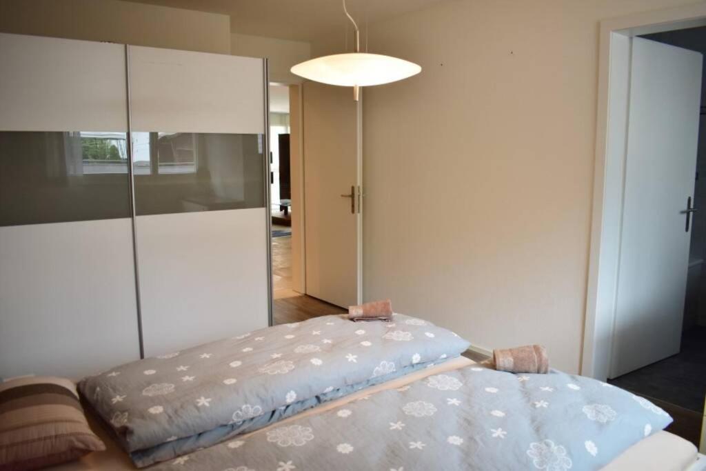 a room with a bed and a large cabinet at Modern Apartment 모던 펜션 in Interlaken
