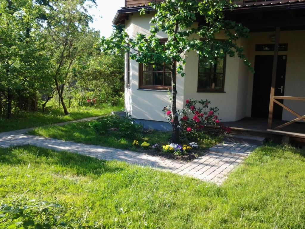 a house with a path leading to the front door at Boutigue city house with terrace and garden free parking in Rīga