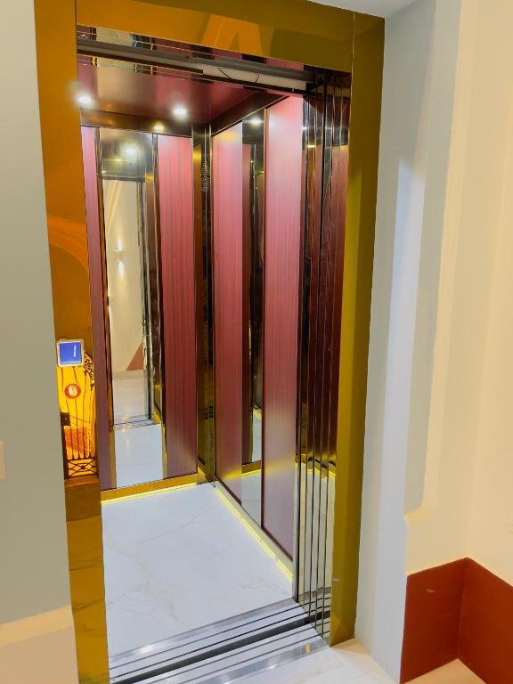 a room with a glass door in a room at Coco's Apartment in Meta