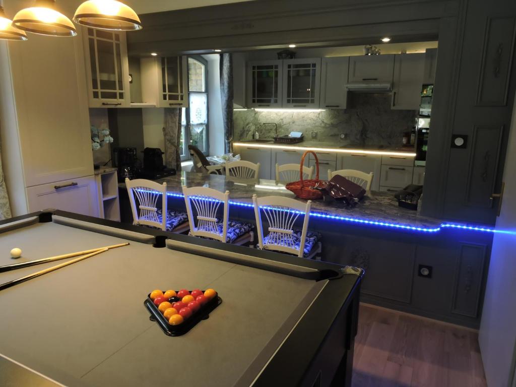 a kitchen with a pool table with balls on it at Gîte de l'Ancienne Scierie in Andlau