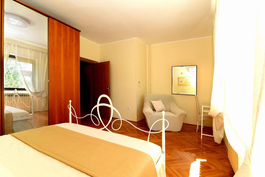 Łóżko lub łóżka w pokoju w obiekcie Holiday Home Villa Margherita