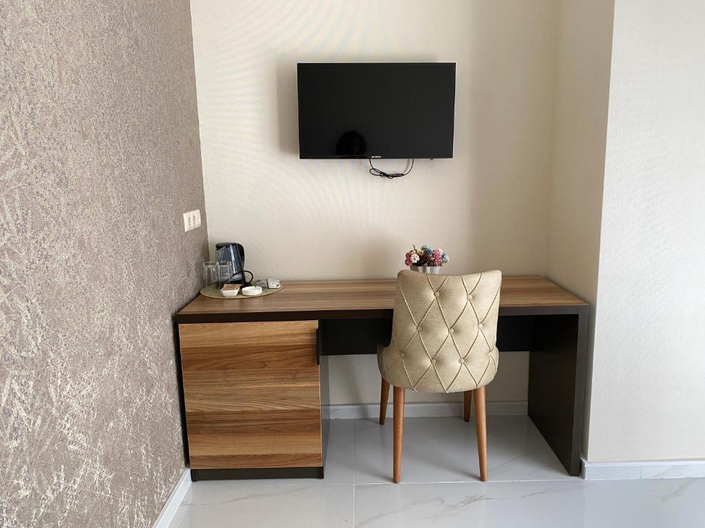 TV a/nebo společenská místnost v ubytování Horizons Hotel Rooms