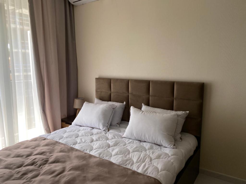 Postel nebo postele na pokoji v ubytování Horizons Hotel Rooms