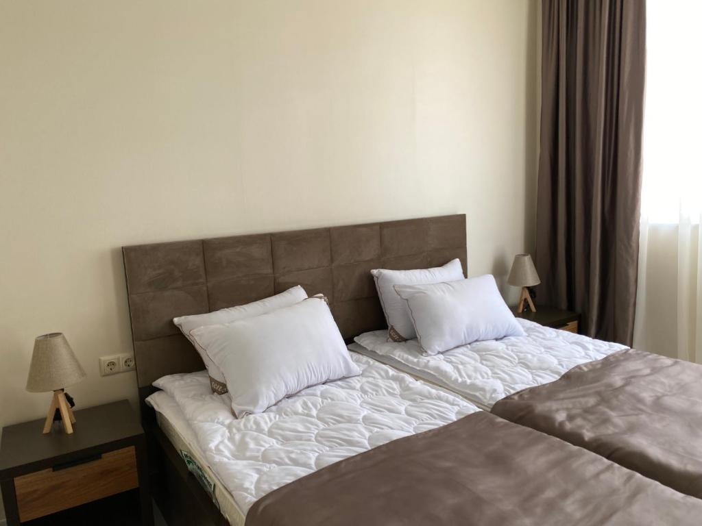 Postel nebo postele na pokoji v ubytování Horizons Hotel Rooms